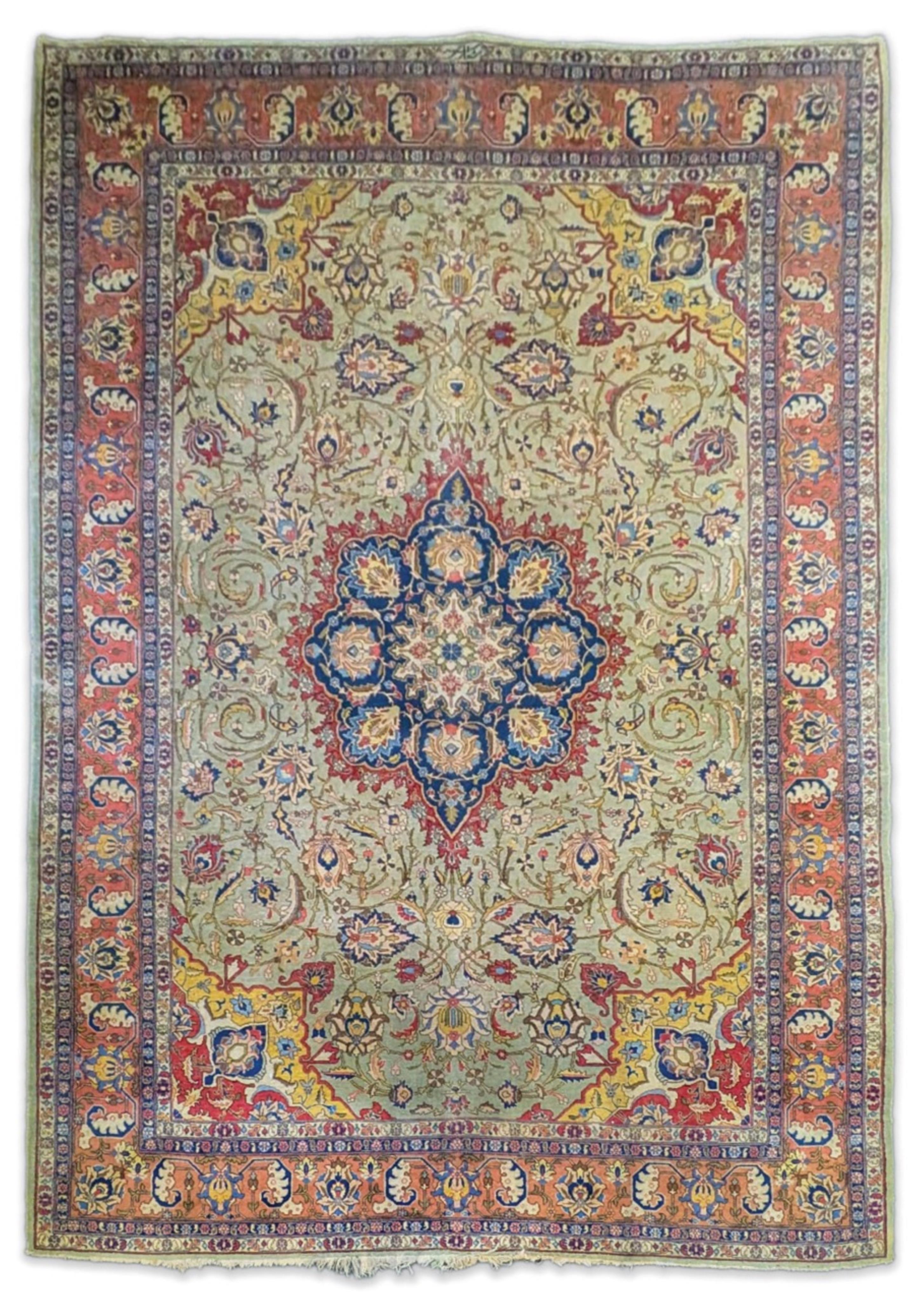 An early 20th century Tabriz pale green ground carpet